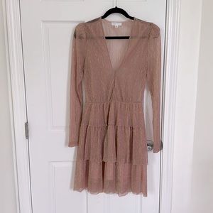 Metallic long sleeve tiered mini dress.